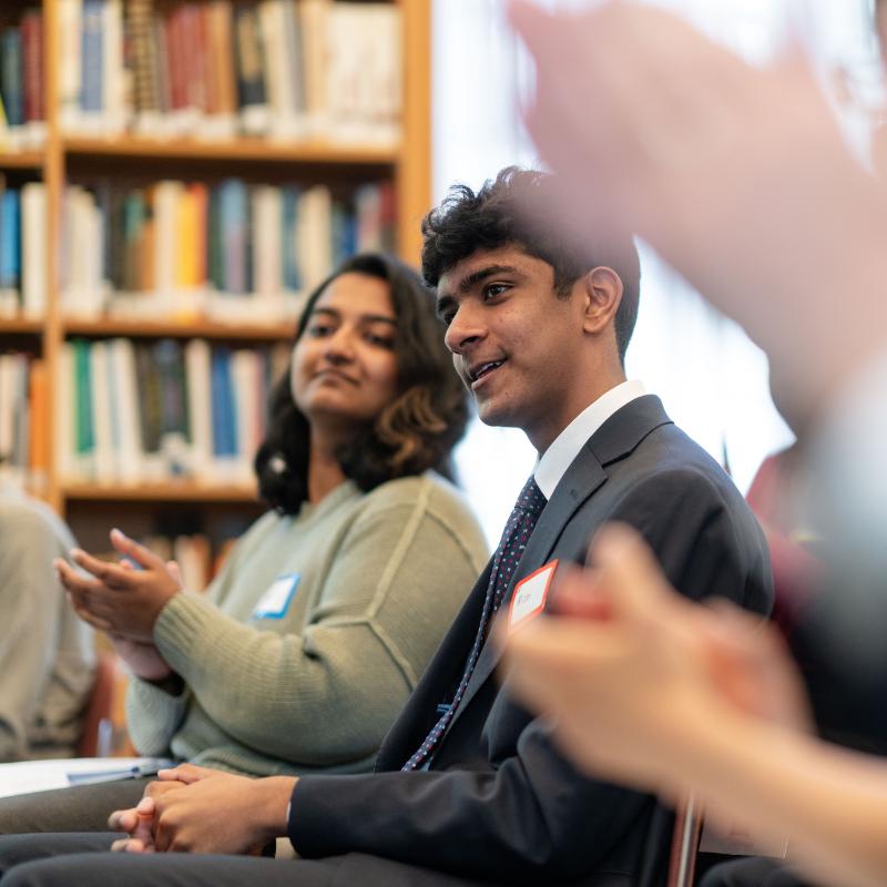 Meeting participants clapping